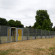 Visitors to the park use a special gate to pass through fences, that have been erected before the U.S. presidential visit at the end of the week, around the U.S. ambassador's residence in Regent's Park in London, Britain, July 10, 2018. REUTERS/Henry Nicholls - RC162E9F4960